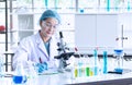 Asian woman scientist, researcher, technician, or student conducted research in laboratory Royalty Free Stock Photo
