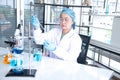 Asian woman scientist, researcher, technician, or student conducted research in laboratory Royalty Free Stock Photo