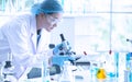 Asian woman scientist, researcher, technician, or student conducted research in laboratory Royalty Free Stock Photo