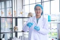 Asian woman scientist, researcher, technician, or student conducted research in laboratory Royalty Free Stock Photo