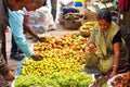 Asian woman sell fruits on the crowd market