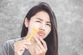 Asian woman shaving mustache on face with a razor Royalty Free Stock Photo