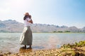 Asian woman shooting photo. Happy traveler. Freedom and lifestyle Royalty Free Stock Photo