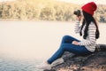 Asian woman shooting picture in nature Royalty Free Stock Photo