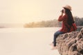 Asian woman shooting picture in nature Royalty Free Stock Photo