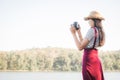 Asian woman shooting picture in nature Royalty Free Stock Photo