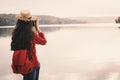 Asian woman shooting picture in nature Royalty Free Stock Photo