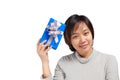 Asian woman short hair hold blue wrapped gift