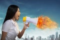 Asian Woman Shouting Megaphone On Fire Royalty Free Stock Photo