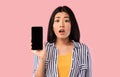 Asian woman showing blank smartphone screen for mockup Royalty Free Stock Photo