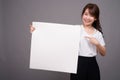 Asian woman showing empty white board with copyspace Royalty Free Stock Photo