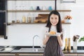 Asian woman showing fried rice in kitchen Royalty Free Stock Photo