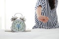 Asian woman sitting on the bed She straightened and writhe when she woke up in the morning. Royalty Free Stock Photo