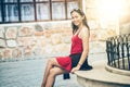 Asian woman sitting on Stone bench in city Royalty Free Stock Photo