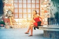 Asian woman sitting on Stone bench in city Royalty Free Stock Photo