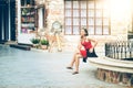 Asian woman sitting on Stone bench in city Royalty Free Stock Photo