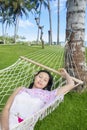 Asian woman sleep in hammock at beach Royalty Free Stock Photo