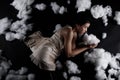 Asian Woman sleep on Scatter Fake Cloud at Night Sky Time