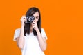 Asian woman smiling pretty girl in white shirt taking photo on camera Royalty Free Stock Photo