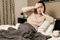 Asian woman sneezing, fever, headache and self quarantine at home .the infection from germ, bacteria, covid19, corona , sars , in