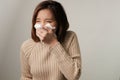 Asian woman sneezing because infection from germ, bacteria, covid19, corona , sars , influenza virus on white background. Sick and