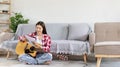 Asian woman specializes in music is composing the lyrics and melody for the opening of a new single Royalty Free Stock Photo