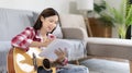 Asian woman specializes in music is composing the lyrics and melody for the opening of a new single Royalty Free Stock Photo