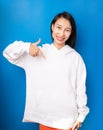 Asian woman in sports casual white jumper hoodie empty space