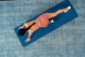 Asian woman in sportswear doing burpee on exercising mat. Top view Vigorous Royalty Free Stock Photo