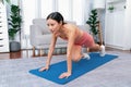 Asian woman in sportswear doing burpee on exercising mat. Vigorous Royalty Free Stock Photo