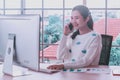 Asian woman staff working,smartphone and pc computer,happy smiling at home office,remote presenting marketing plan report online Royalty Free Stock Photo