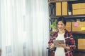 Asian woman startup small business at home office. Online seller entrepreneur young asian woman use tablet checking online order. Royalty Free Stock Photo