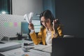Asian woman is stressed while working on laptop, tired asian businesswoman with headache at office, feeling sick at work, Stressed Royalty Free Stock Photo