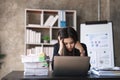 Asian woman are stressed while working on laptop, Tired businesswoman with headache at office, feeling sick at work Royalty Free Stock Photo