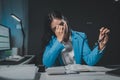 Asian woman is stressed while working on laptop, tired asian businesswoman with headache at office, feeling sick at work, Stressed Royalty Free Stock Photo