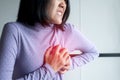 Asian woman with strong chest pain and hands touching her chest,Heart attack symptom Royalty Free Stock Photo