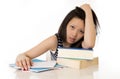 Asian woman student overworked on textbooks Royalty Free Stock Photo