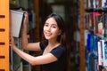 Asian woman student read text book in her university library Royalty Free Stock Photo