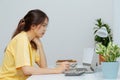 Asian woman studying through online e-learning system at home,  Social distance, E-learning online education and internet, Royalty Free Stock Photo