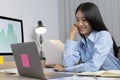 Asian woman is studying online via the internet with a cheerful smile, stay home, New normal Royalty Free Stock Photo
