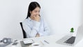 Asian woman is studying online via the internet with a cheerful smile, stay home, New normal, Covid-19 coronavirus, Social distanc Royalty Free Stock Photo