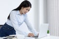 Asian woman is studying online via the internet with a cheerful smile, stay home, New normal, Covid-19 coronavirus, Social distanc Royalty Free Stock Photo