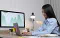 Asian woman is studying online via the internet with a cheerful smile, stay home, New normal Royalty Free Stock Photo