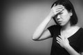 Asian woman suffer from having a strong headache, suffocate and fever,VIRUS COVID-19 or Epidemic disease . Black and white tone Royalty Free Stock Photo