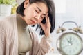 Asian woman suffering from chronic daily headache