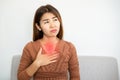 Asian woman suffering from gastroesophageal, acid reflux disease or heartburn Royalty Free Stock Photo