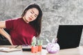 Asian woman suffering from lower back pain sitting too long on chair working on computer Royalty Free Stock Photo