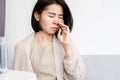 Asian woman suffering from stuffy nose having runny nose and bad breath Royalty Free Stock Photo