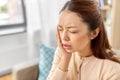 Asian woman suffering from toothache at home Royalty Free Stock Photo