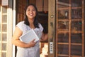 Asian woman, tablet and door of restaurant to welcome service, small business owner or hostess. Manager at entrance